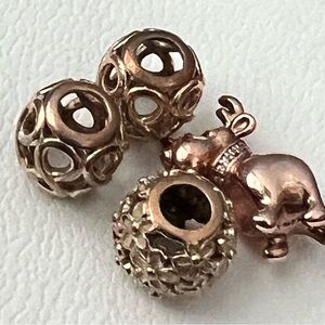 4 authentic Pandora charms. Rose Color